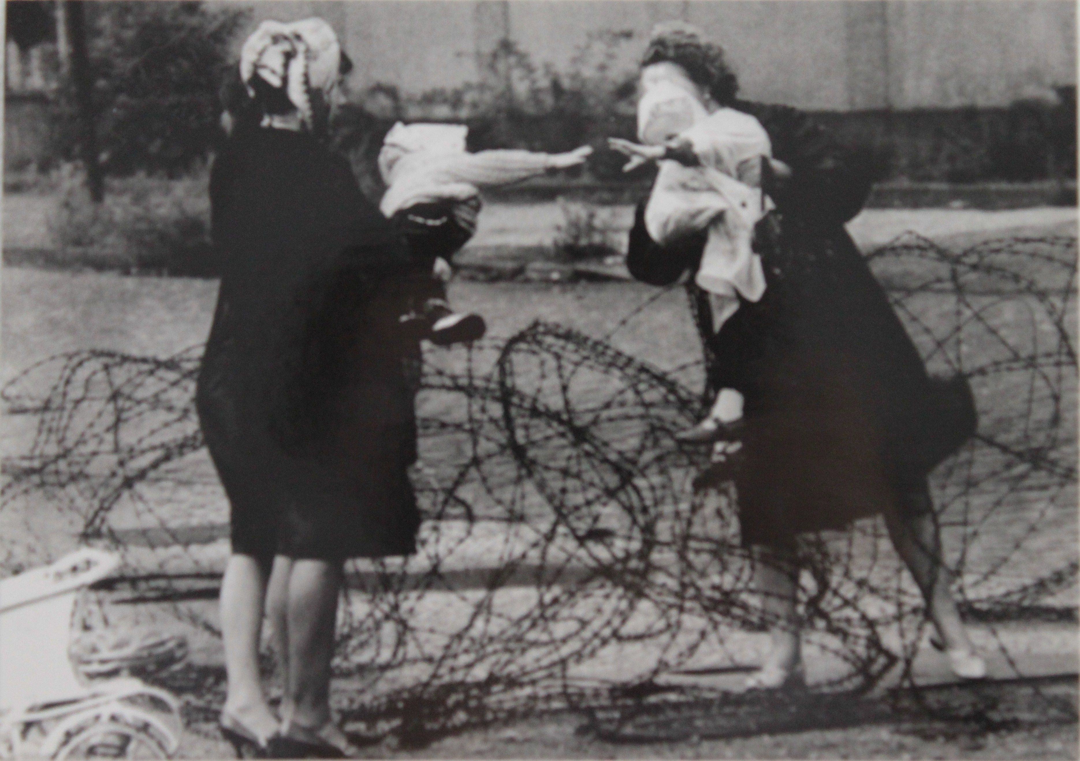 reaching-across-the-wire.jpg
